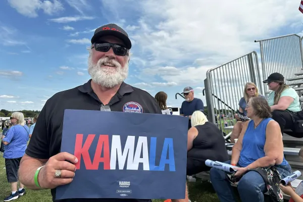 photo:  union member with Kamala sign 