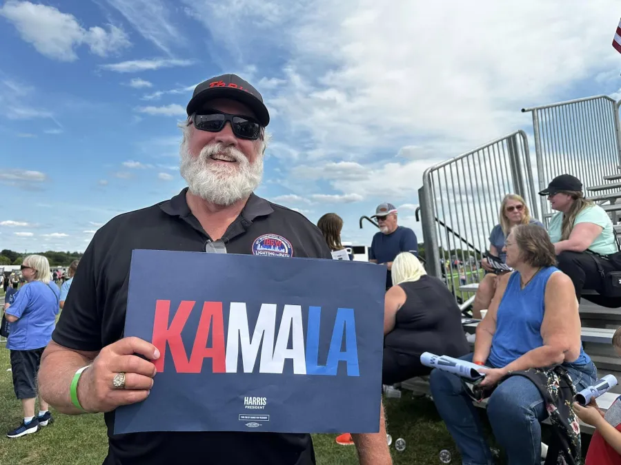 photo:  union member with Kamala sign 